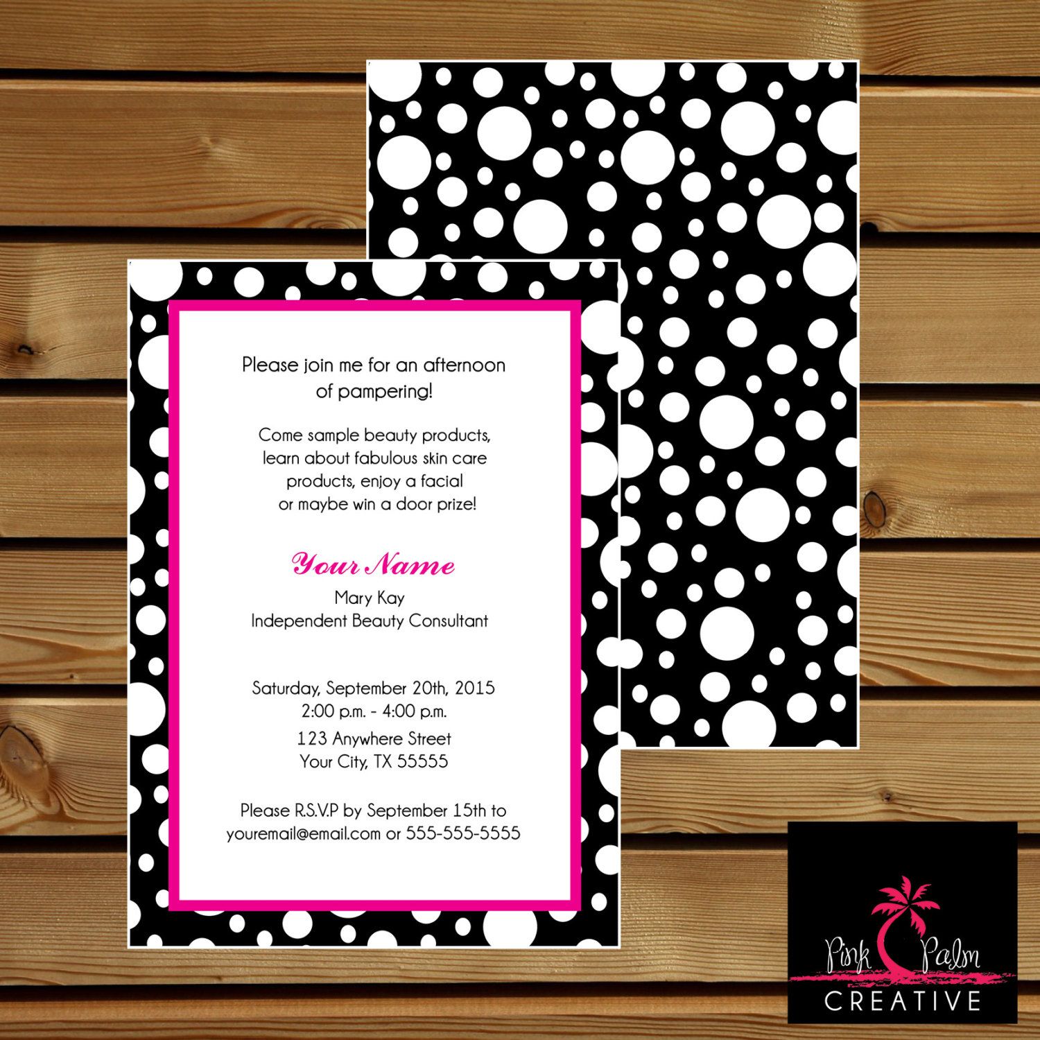 a black and white polka dot print wedding card with pink trim, on wood ...