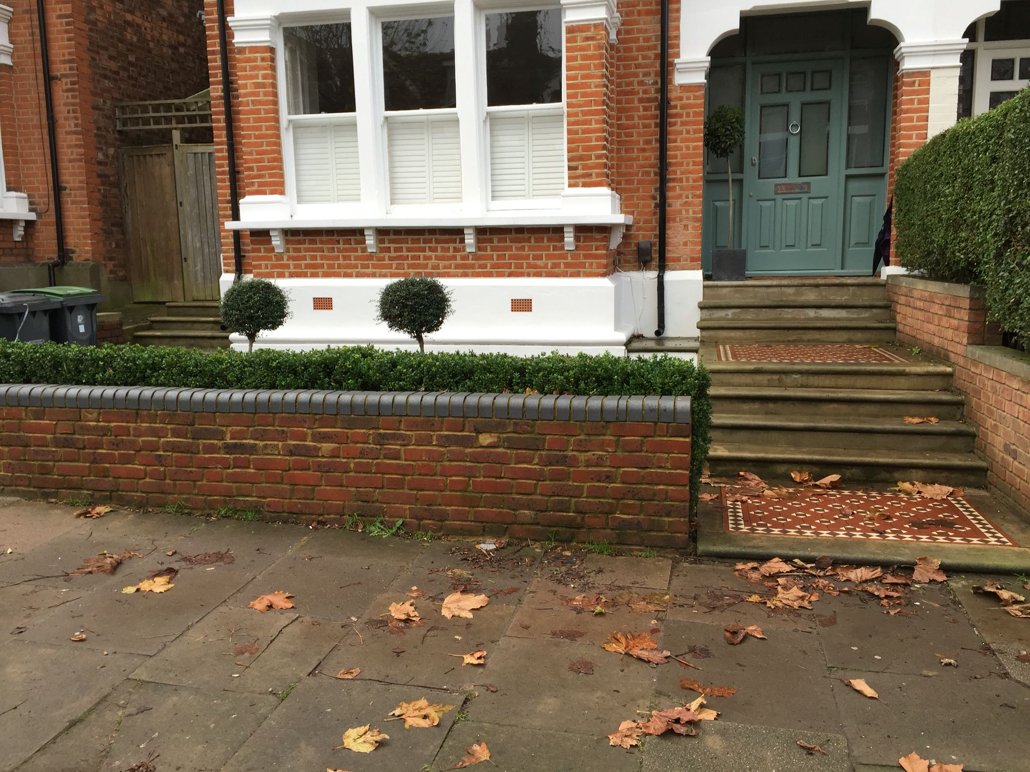 Simple low brick wall with contrasting coping bricks Outdoor decor