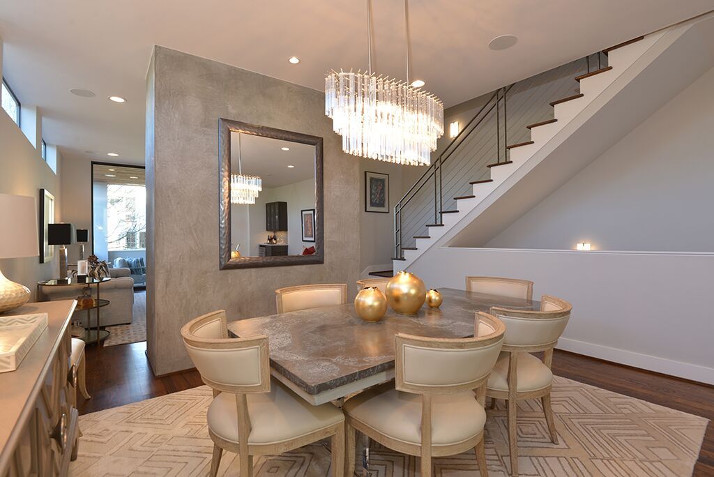 Love the gray accent wall in this dining area! Custom homes, Grey