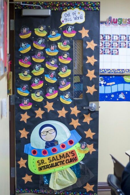 Space themed classroom door! The alien ships were made using clear dome ...