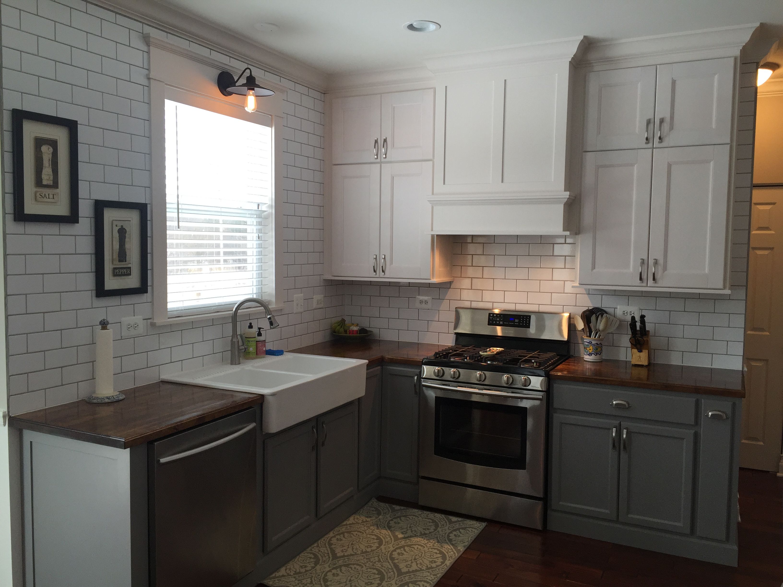 After picture of kitchen with Butcher block counter top, crown molding