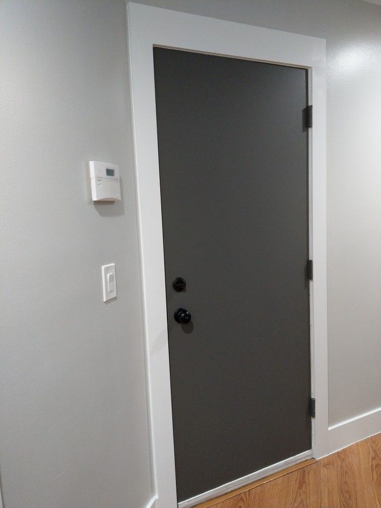 Black interior doors. Kendall Charcoal door, Repose Gray wall, white