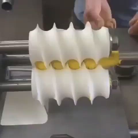 This may contain: a machine that has some kind of plastic thing on it's handle and is making something out of white paper