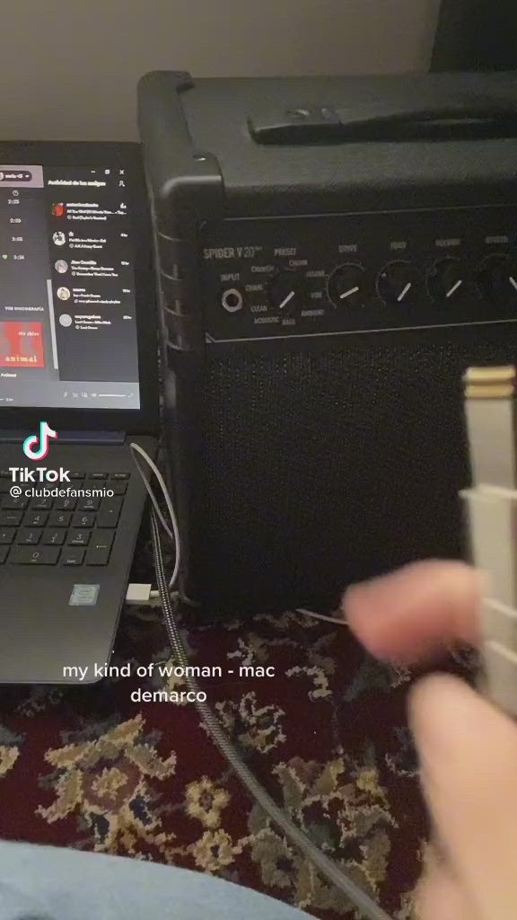 This may contain: a woman is playing an electric guitar in her living room with the caption, my kind of woman - mac demaco