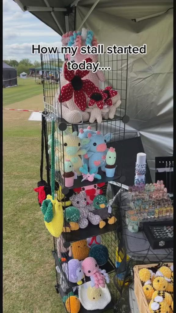 This may contain: there are many stuffed animals on display at this event, and the caption says how my stall started today