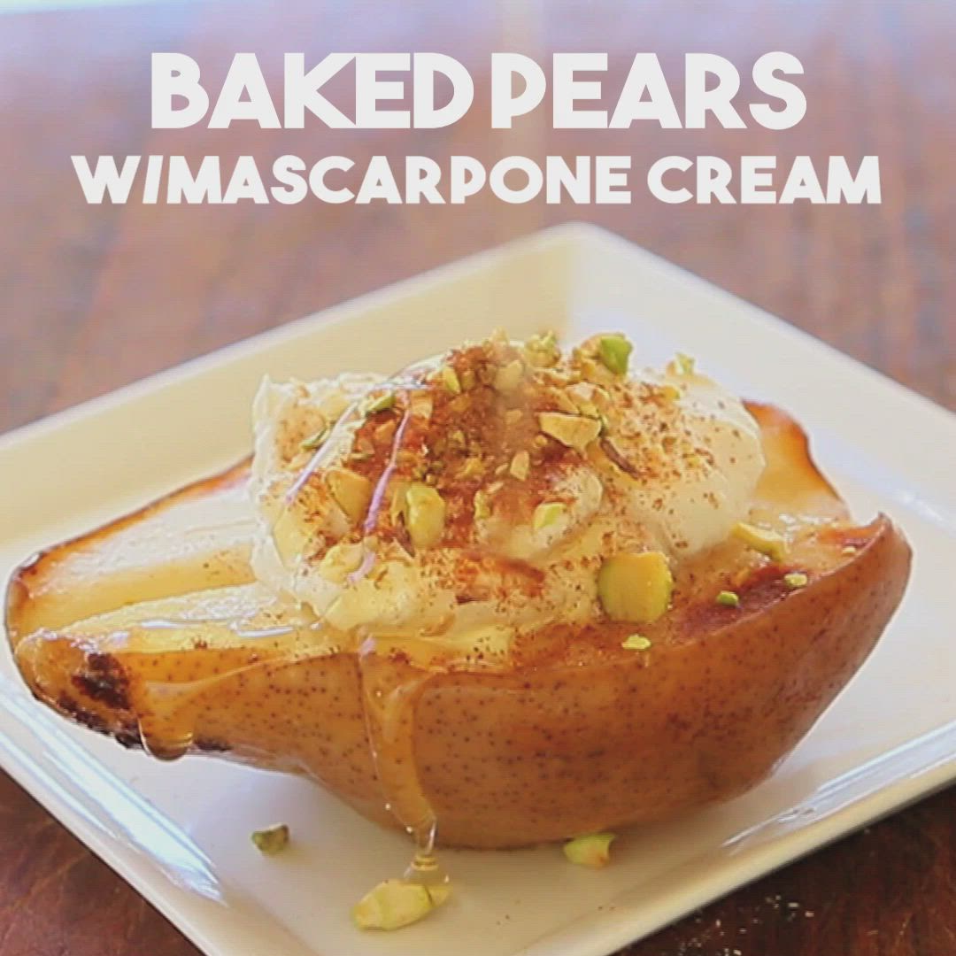 This may contain: baked pear mascarpone creme on a white plate