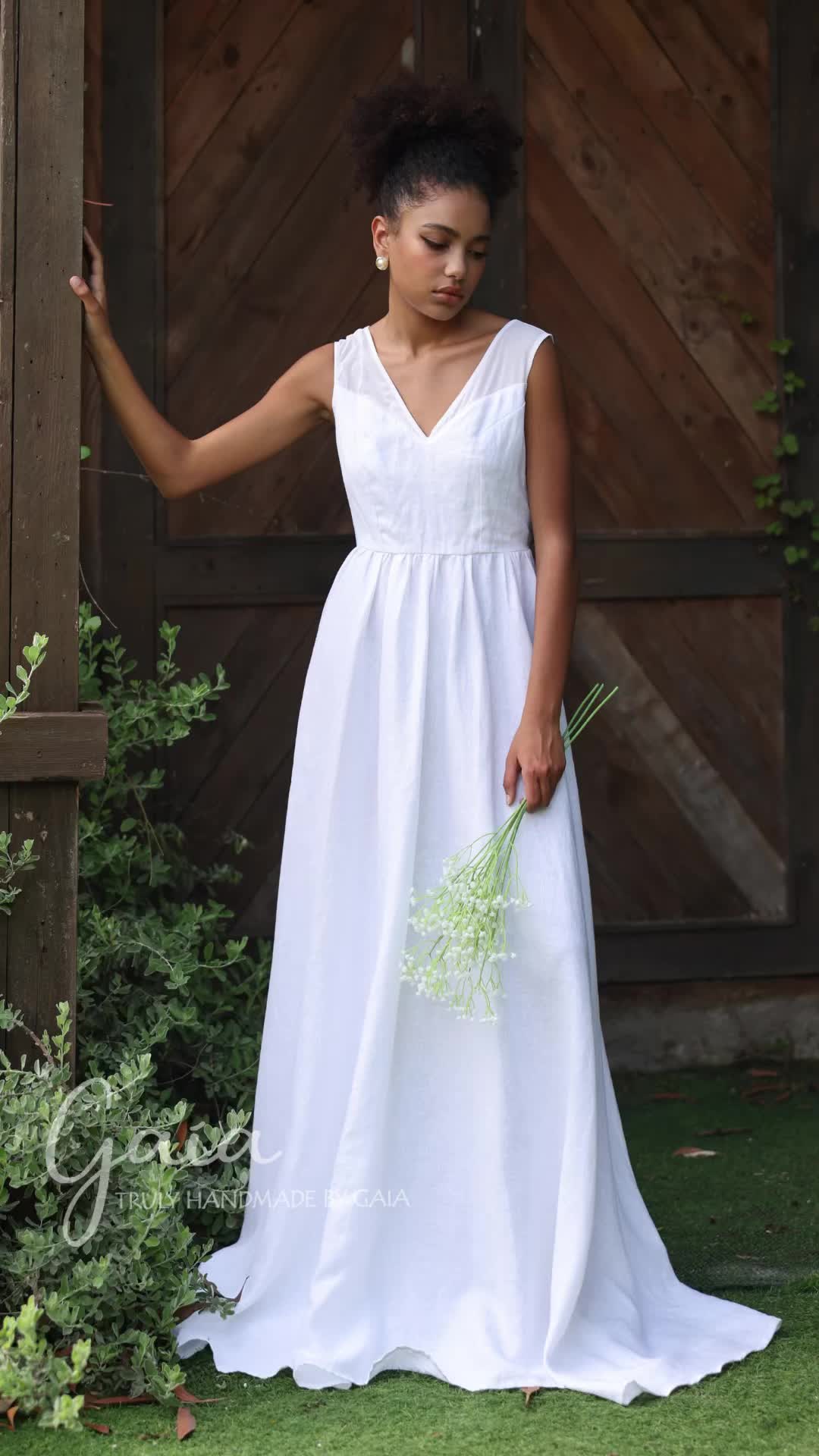 Experience the elegance of this linen wedding dress, crafted for timeless beauty. This classic design features a V-neck, sleeveless cut, gathered waist, V-back, and side pockets. Made from washed linen, it provides a soft and breathable feel, perfect for your special day. You can explore our 100+ products at: https://madebygaia.vn/ #linenweddingdress