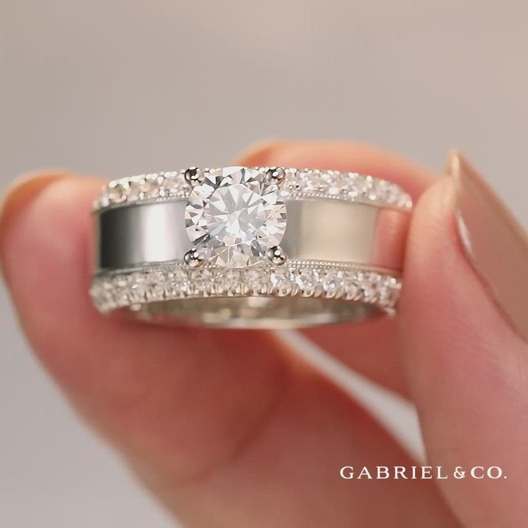 This contains: An eye-catchy ring setting with glittering round diamonds and a milgrain border💎 
Amos - 14K White Gold Round Diamond Wide Band Engagement Ring
ER14611R4W44JJ