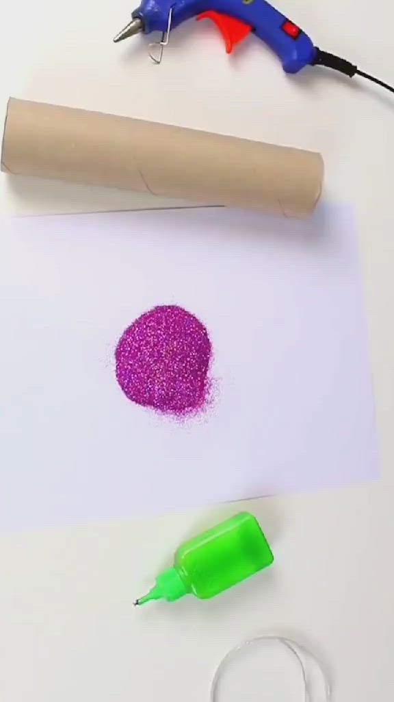 This may contain: a woman is using scissors to cut up strips of paper on a white table top