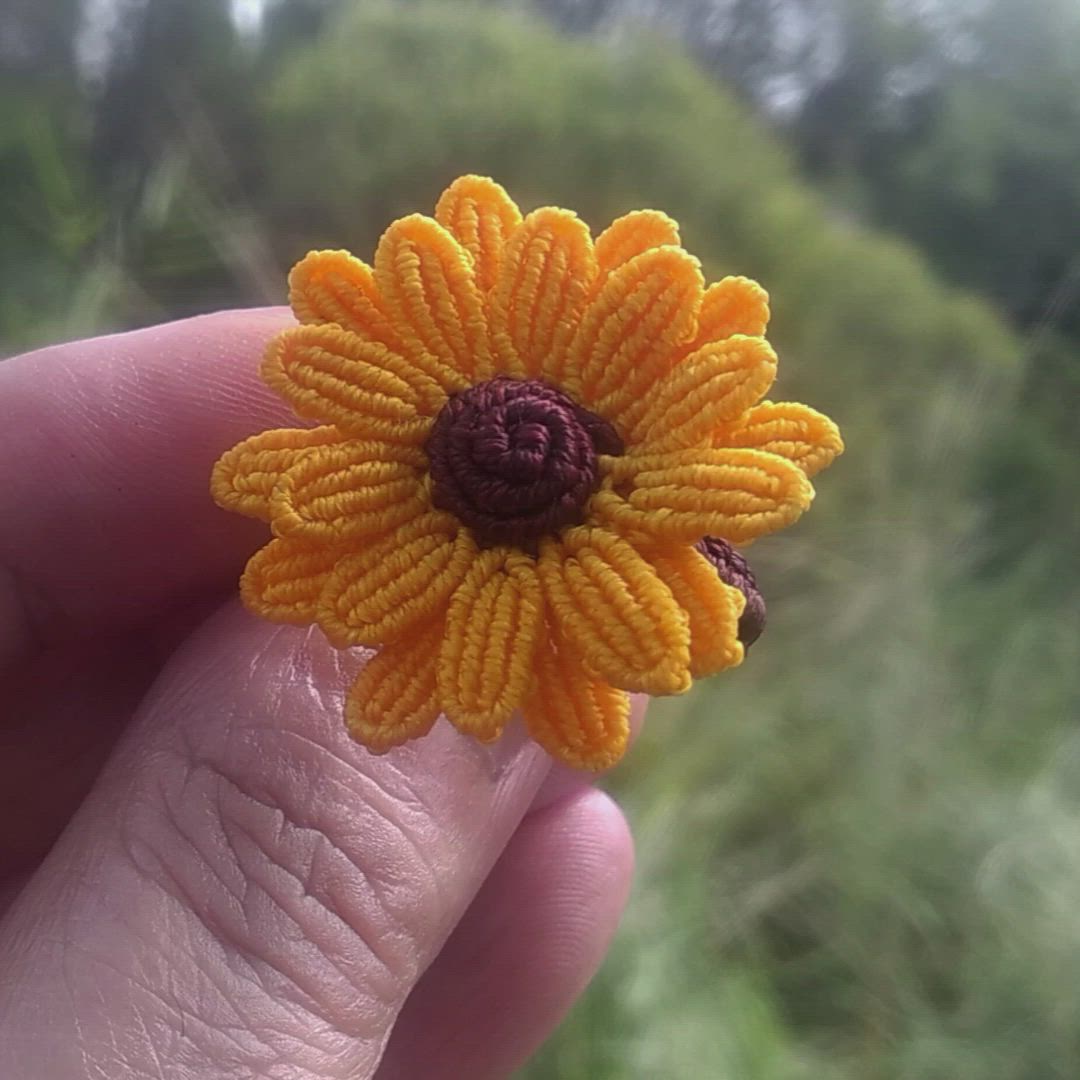 This contains: Macrame Sunflower Ring by ArtesaniasDeBrujilda