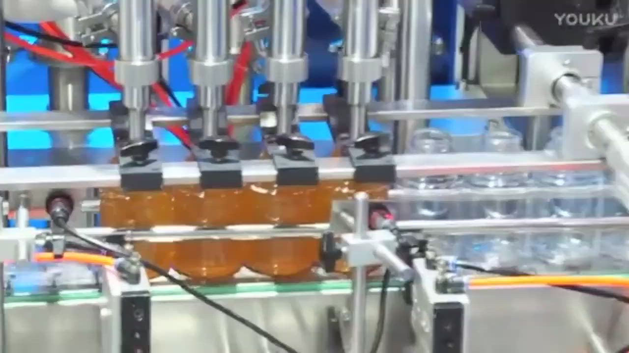 This may contain: an assembly line with liquid bottles and wires