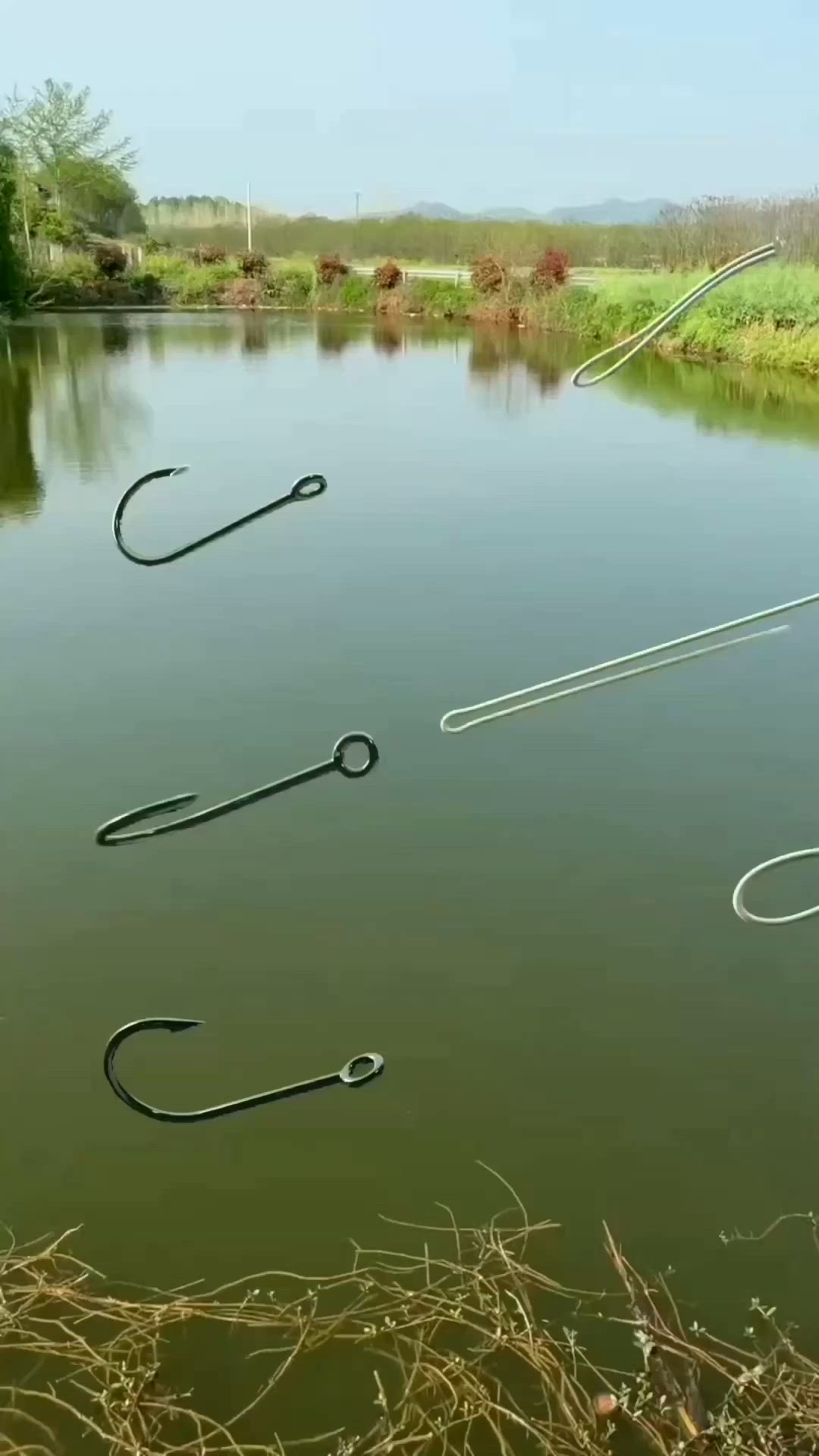 This may contain: two fishing hooks are hooked up to the water