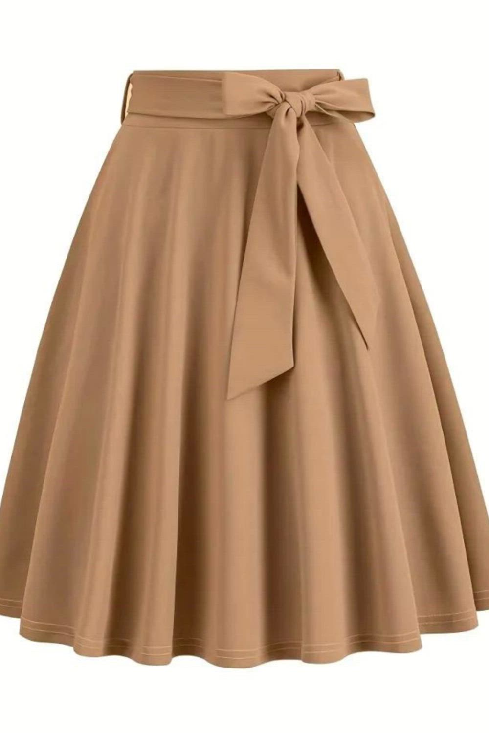 Elevate your style with our Retro A-line Skirt featuring a charming bowknot front. Perfect for any occasion - from parties to performances, or even everyday wear. Embrace timeless elegance and make a statement effortlessly.