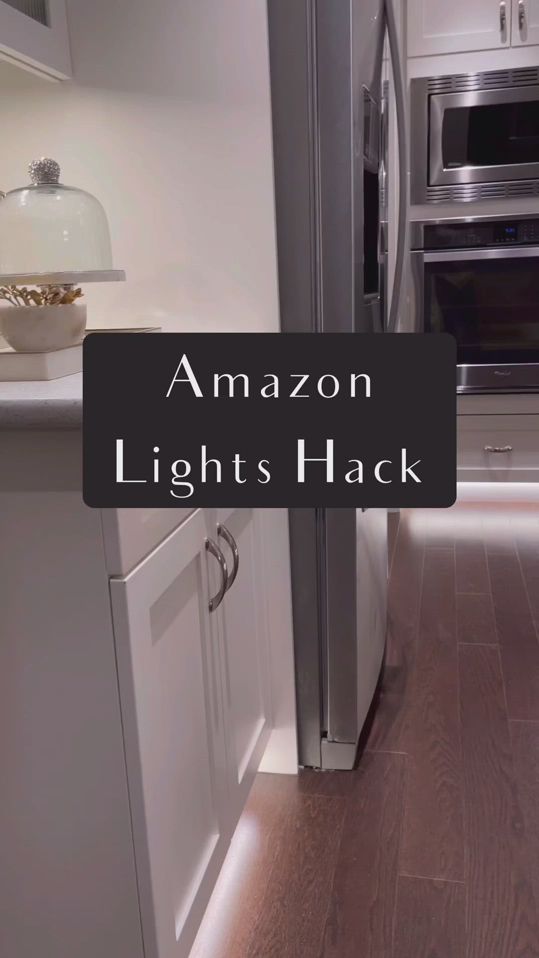 This may contain: a kitchen with white cabinets and wood flooring has the words amazon lights hack on it