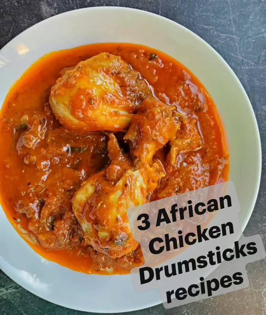 This may contain: three african chicken drumsticks are in a white bowl with red sauce on the side