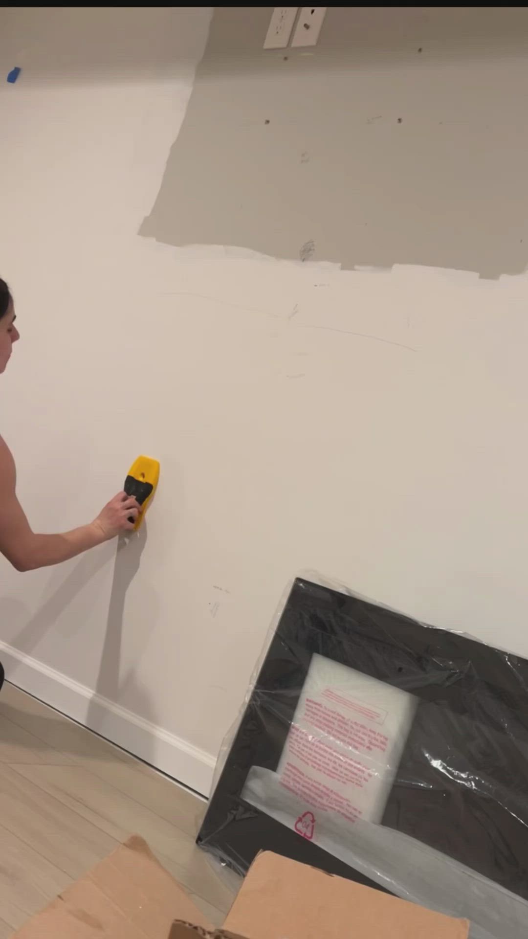 This may contain: a woman is standing in the middle of a room that has been built with wood