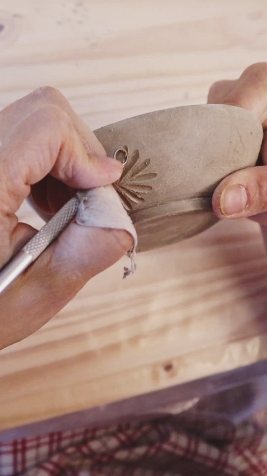 This may contain: a person is carving something on a wooden board