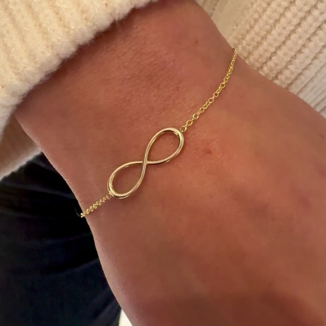 Introducing yet another meaningful piece from our infinity collection. The infinity symbol carries a spiritual meaning, essentially representing anything that is infinite in value, but adding even more meaning to that notion now you can personalize this 14K Solid Gold handcrafted letter bracelet with your favorite letters to carry with you every day. A perfect bracelet to accentuate your stack and a true everyday piece that is accentuated by your personalized touch.

Size: 21mm (W) X 7mm (H)
Sol