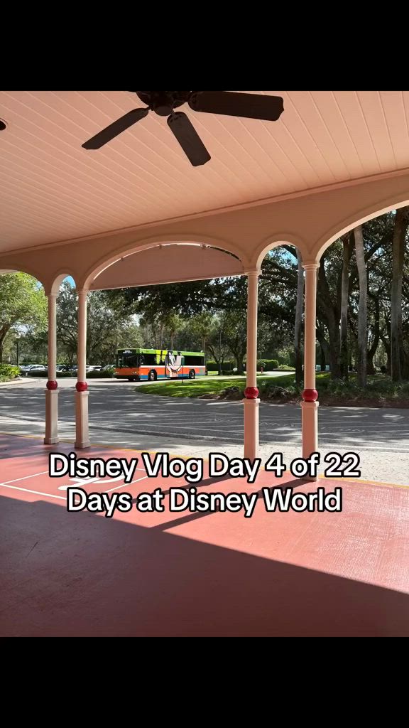 This may contain: an outdoor covered area with a ceiling fan in the center and disney's very big day 4 of 2 days at disney world