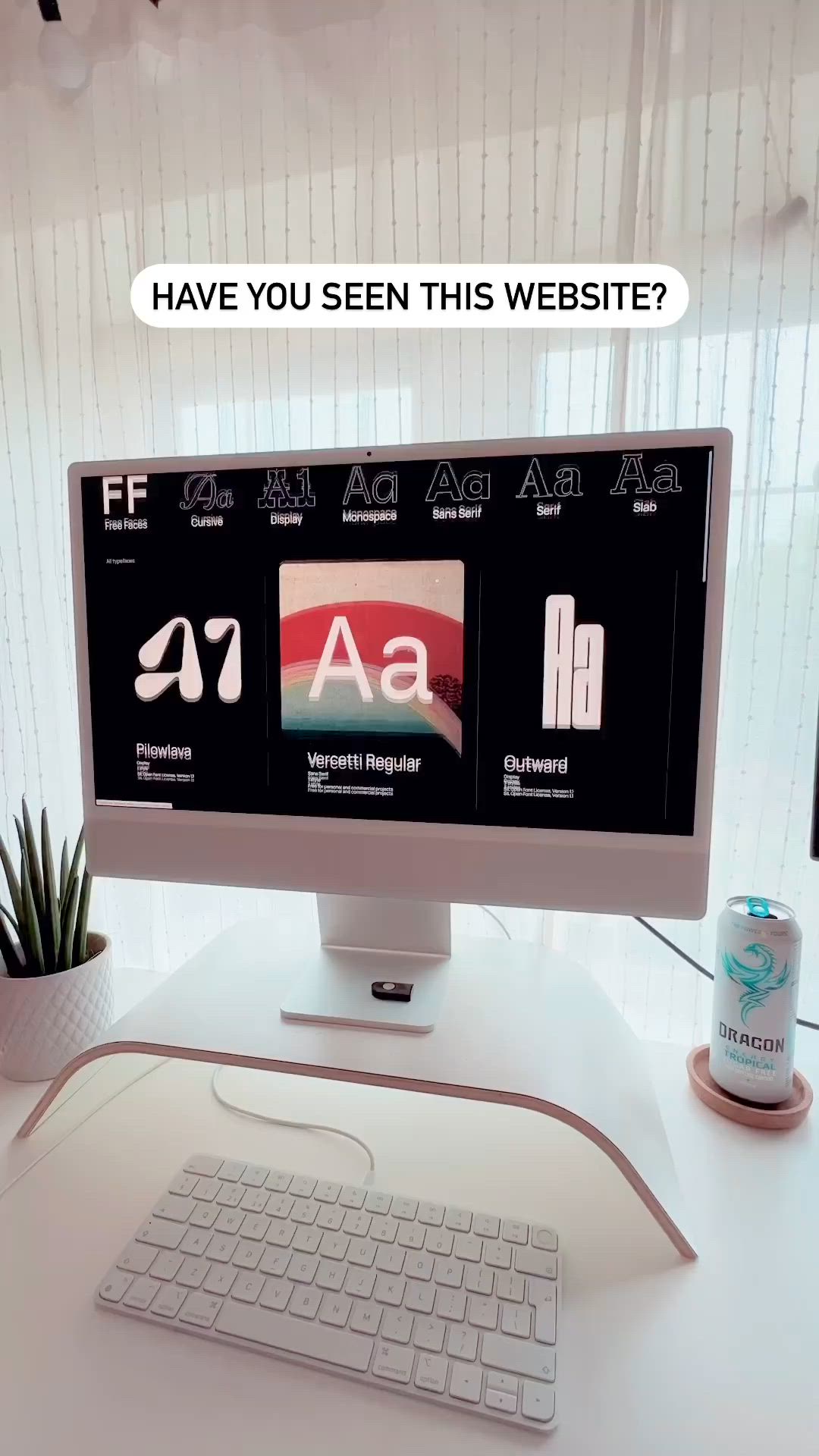 This may contain: a computer monitor sitting on top of a white desk next to a keyboard and mouse