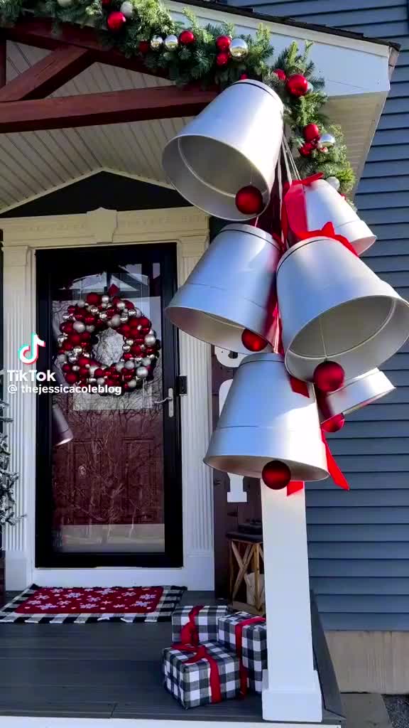 This contains: DIY $1 Dollar Tree Christmas Bells Outdoor Decor. Using Dollar Store plastic planters, spray paint silver or gold. String an ornament inside for bell effect. Easy Christmas craft. Budget christmas. Christmas porch, Christmas entryway. Large Christmas ornaments. Christmas garland. Front door. Christmas garland idea. Large gold bells. Large silver Christmas bells. Up cycling plastic planters. Christmas up cycling.