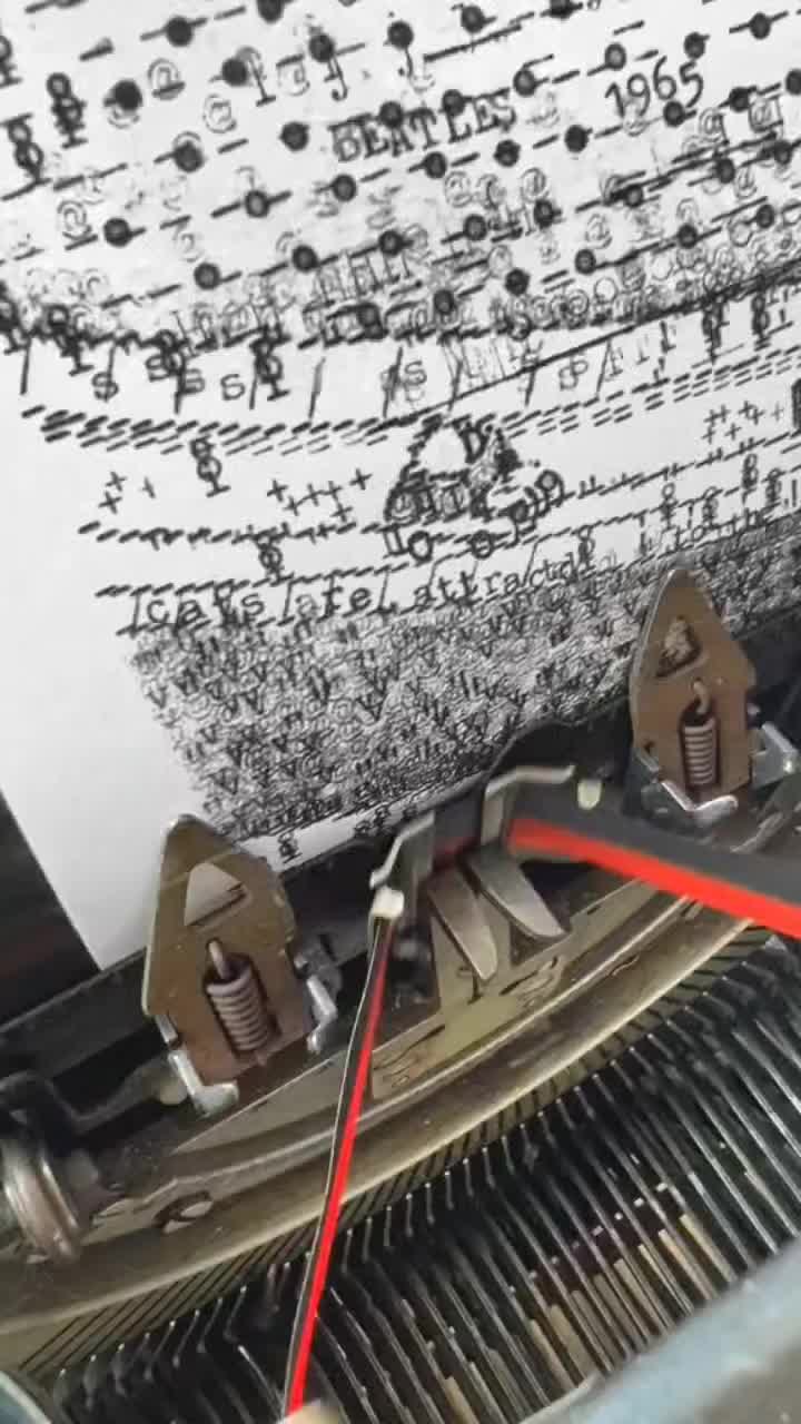 This may contain: an old typewriter with some wires attached to it