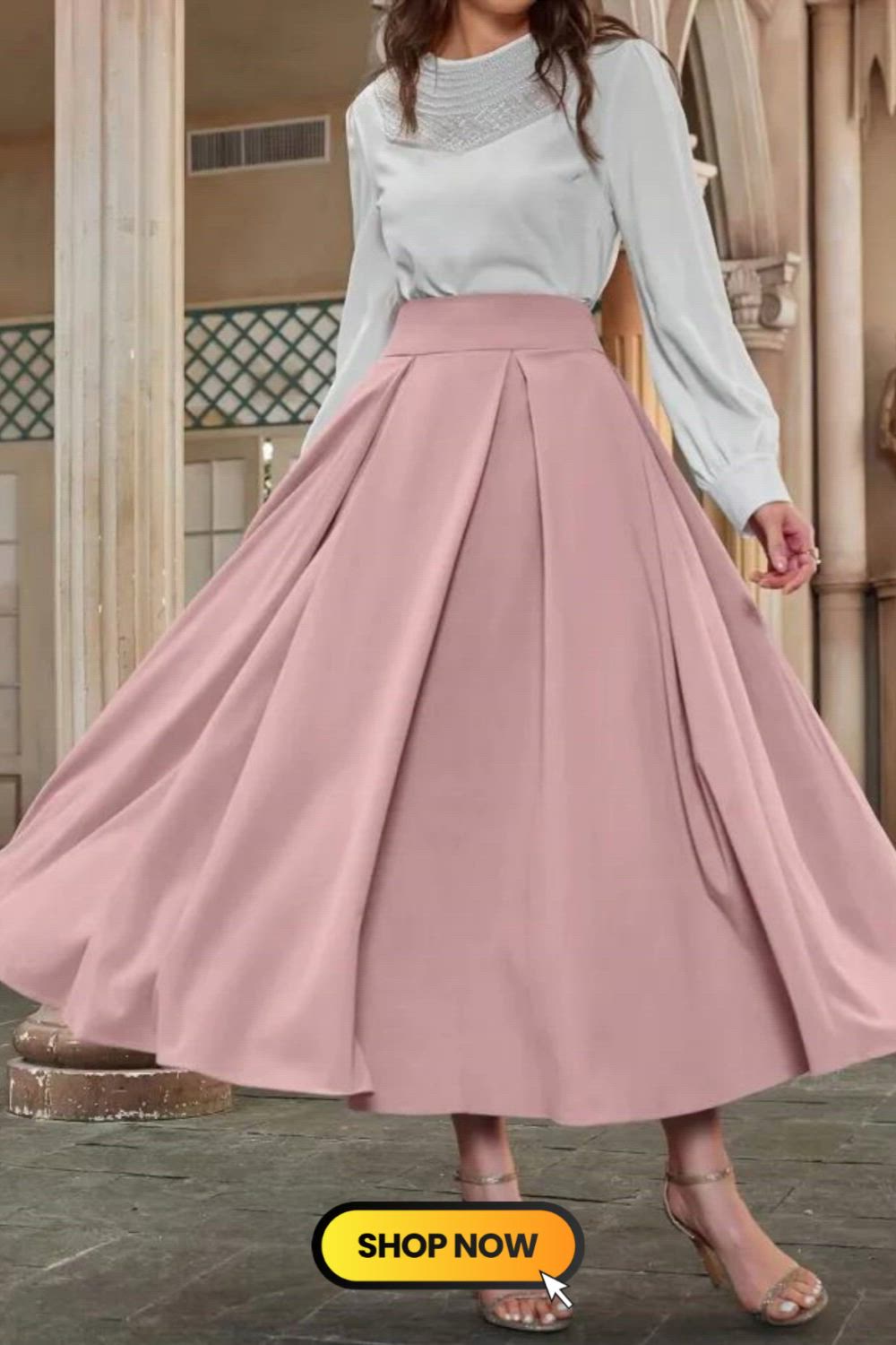 Elevate your style with this Solid Color Ankle Length Pleated Skirt. Its elegant high waist design and ankle-length silhouette exude sophistication and charm. The pleated detail adds a touch of femininity, making it a versatile and chic addition to your wardrobe. Perfect for a variety of occasions.