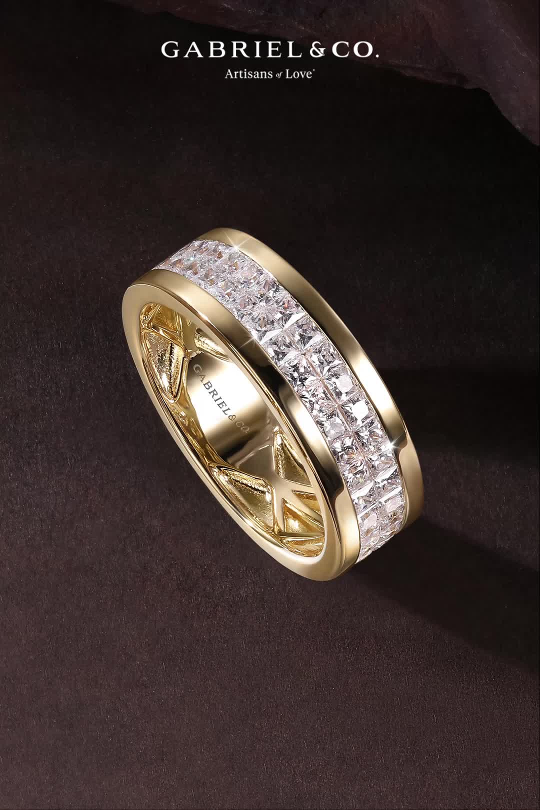 This may contain: a gold ring with white diamonds on it and the words gabriel & co