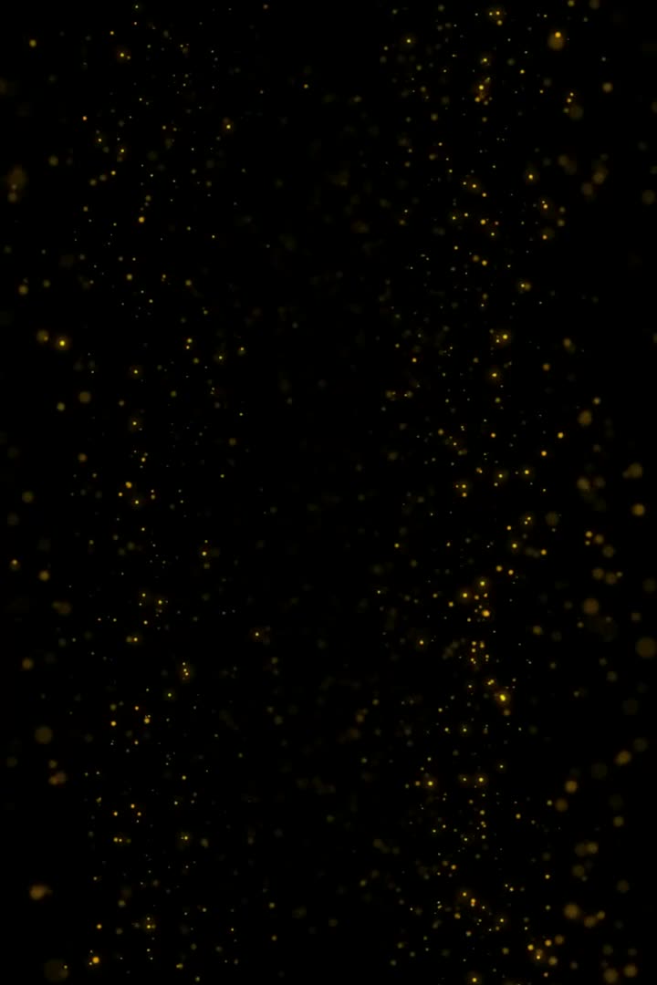 This may contain: the dark background is filled with small gold dots and sparkles, like stars or glitters