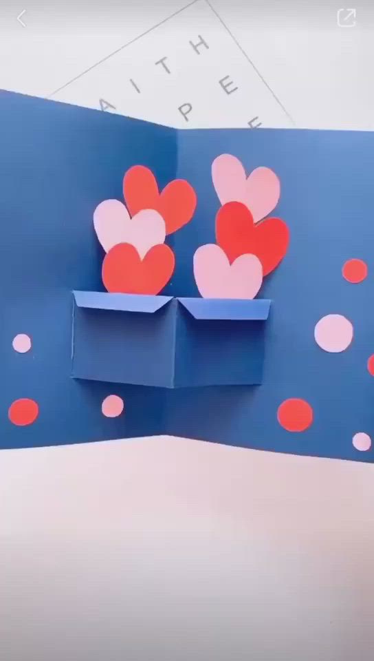 This may contain: an origami valentine's day card with hearts in a box