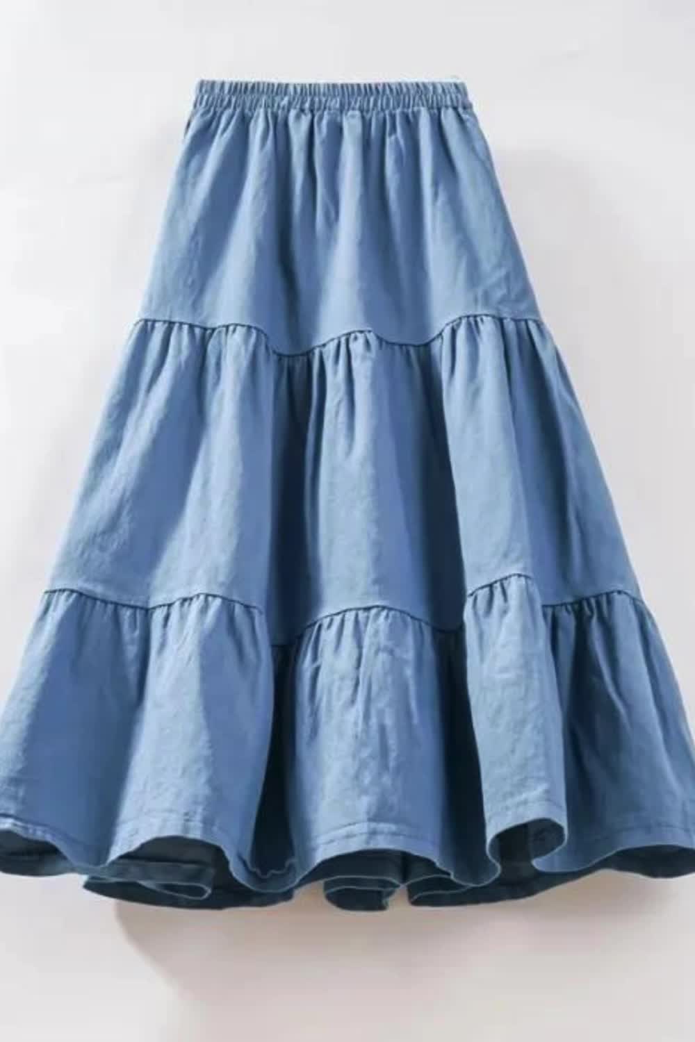 This vintage A-line denim skirt combines classic style with a modern flair. Featuring a high waist and patchwork detailing, it exudes retro charm with a contemporary twist. The layered design adds depth and dimension to the silhouette, making it a versatile and stylish addition to any wardrobe.