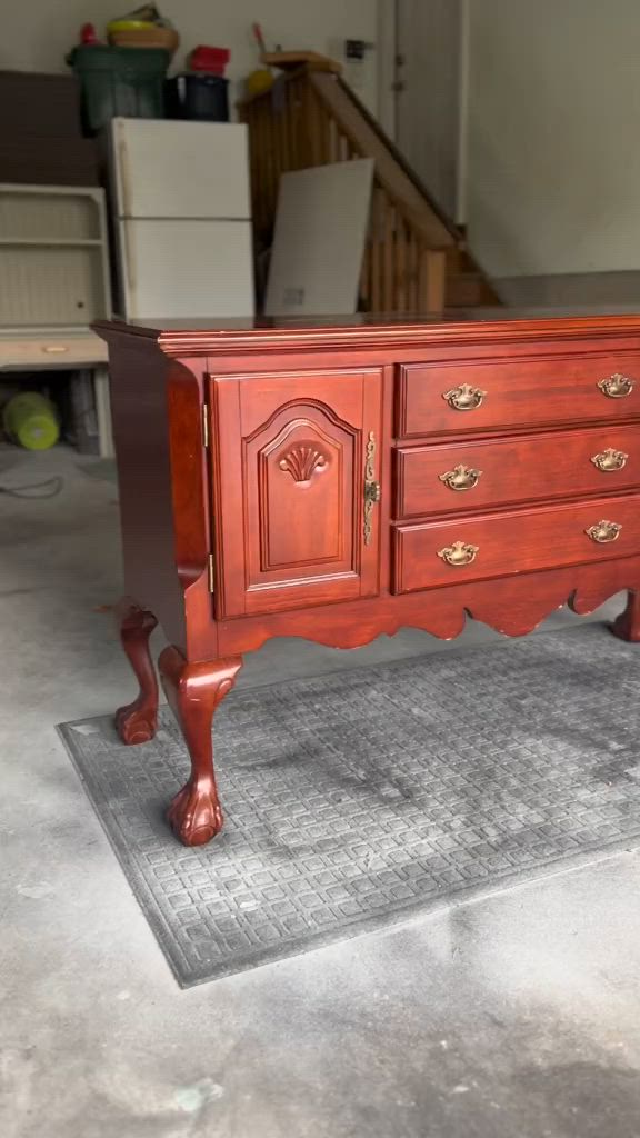 This may contain: an old dresser is in the middle of a room