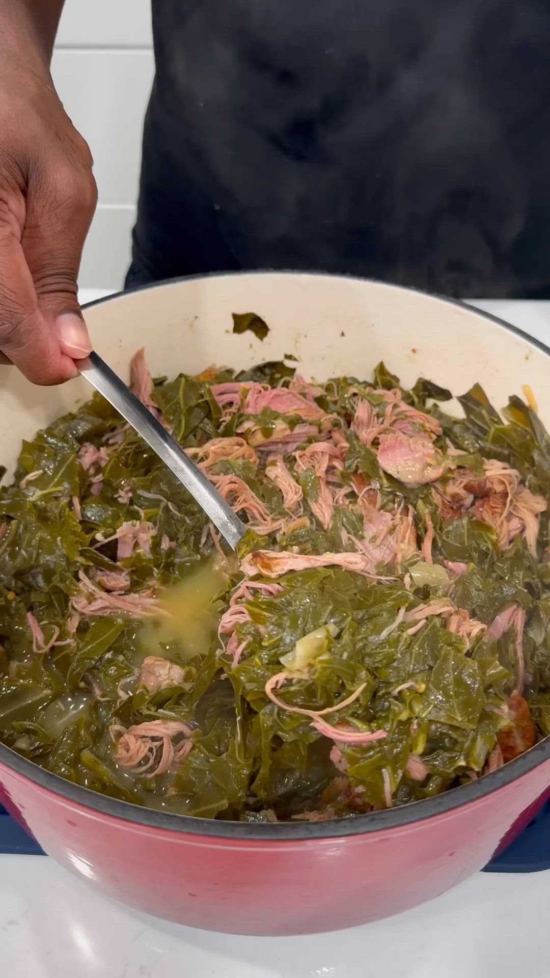 This may contain: a man is eating greens in a white bowl