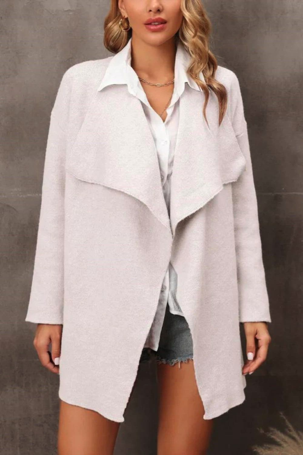 Wrap yourself in warmth and style with our Solid Color Lapel Knit Cardigan Coat. This cozy and chic cardigan is a versatile addition to your winter wardrobe. The lapel design adds a touch of sophistication, while the solid color allows for easy pairing with any outfit. Whether you're heading to the office or going for a casual weekend look, this knit cardigan coat provides the perfect blend of comfort and fashion.