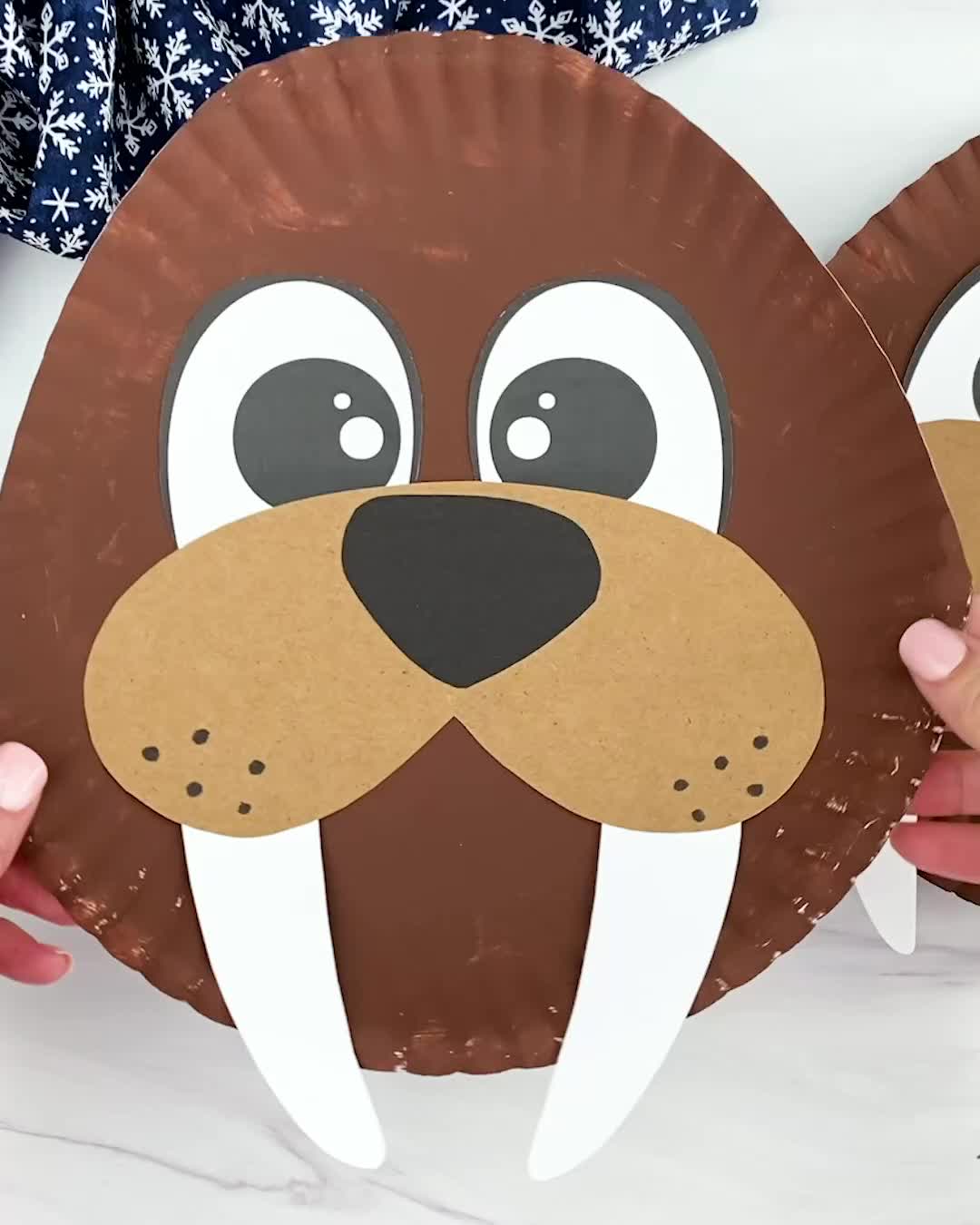 Winter is finally here! If your children love the winter season, they’ll love this paper plate walrus craft for kids. If you need more winter activities for kids, browse our favorite winter animal crafts and find the one that’s perfect for your little ones! Watch our quick video tutorial to learn how to make this fun winter craft! Make sure to also try all our animal crafts and paper plate crafts for kids.