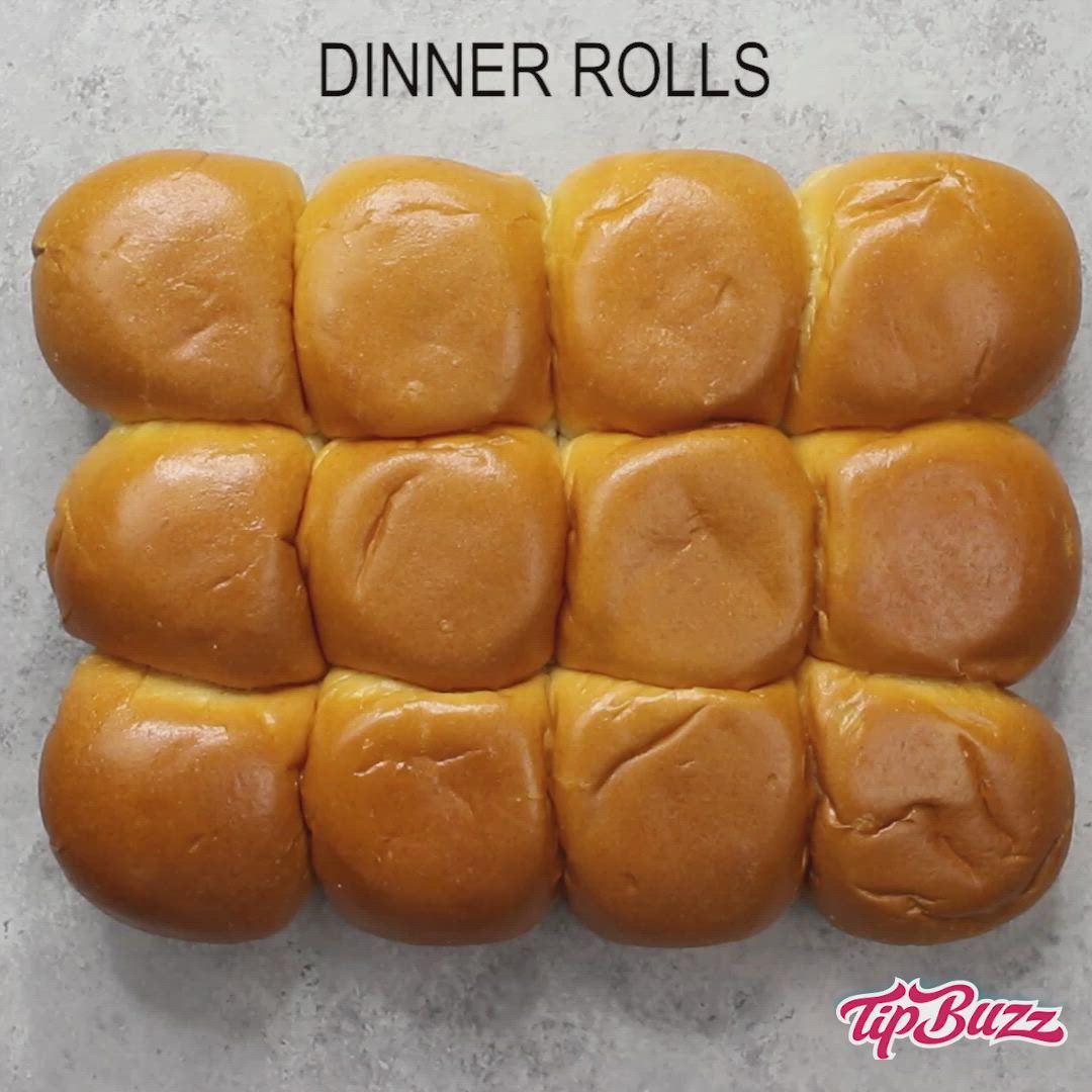 This may contain: a person cutting into buns on top of a table with the words dinner rolls