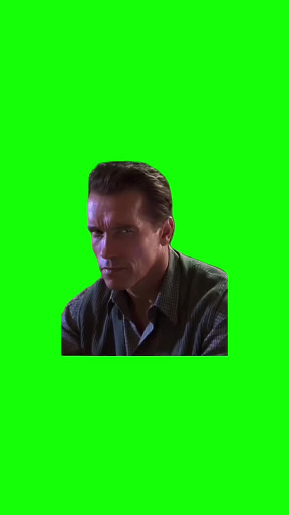 This may contain: a man is sitting down and looking at something green screen