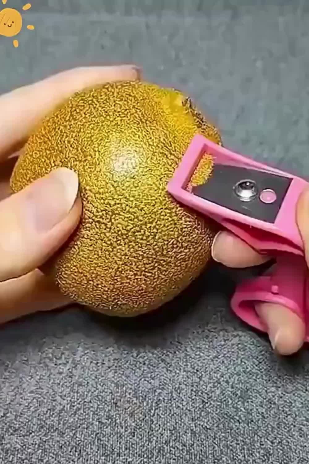 This may contain: someone is cutting an apple into pieces with scissors