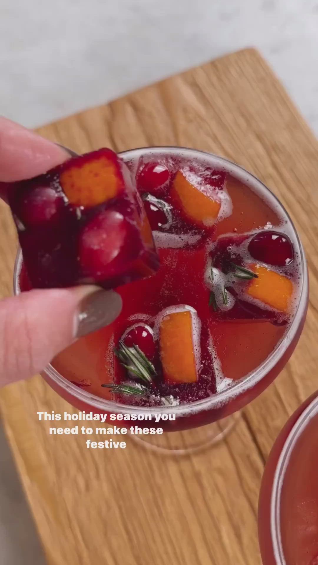 Content Creator: @kalejunkie  Meghan Trainor - It's Beginning To Look A Lot Like Christmas  Looking for a non-alcoholic option? Swap the Prosecco with ginger beer!  To make these pomegranate ice cubes, you need:  An ice cube tray  3/4 cup fresh cranberries  1 orange, chopped  3 sprigs fresh rosemary  1 1/2 cups pomegranate juice (I used @pomwonderful). You can substitute for sweetened cranberry juice if you’d like!  Prosecco  Fill your ice cube tray with the cranberries, orange pieces, and rosemary. Carefully pour pomegranate juice on top. Cover and freeze overnight. When you are ready to make your drinks, add 3-4 cubes to a glass and top off with Prosecco!