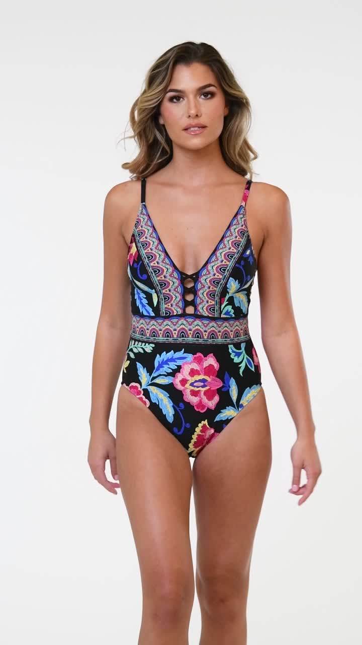 A vibrant black, pink, and blue multicolored floral pattern adorns this plunging over the shoulder one piece swimsuit, creating a striking and energetic look. The combination of bold hues and intricate floral designs adds a touch of sophistication and trendiness to your swimwear look. [split] Details One piece plunge swimsuit Removable cups Adjustable, convertible straps Tummy control Moderate rear coverage Coordinates with solid colors: black, sapphire, magenta, pop pink, seafoam & pineapple Fa