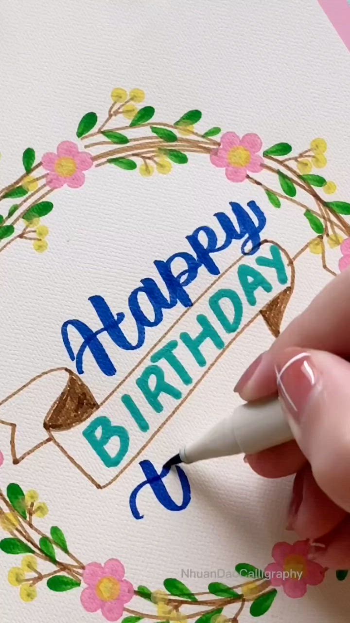 This may contain: a woman is making a card with paper and scissors on the table next to it