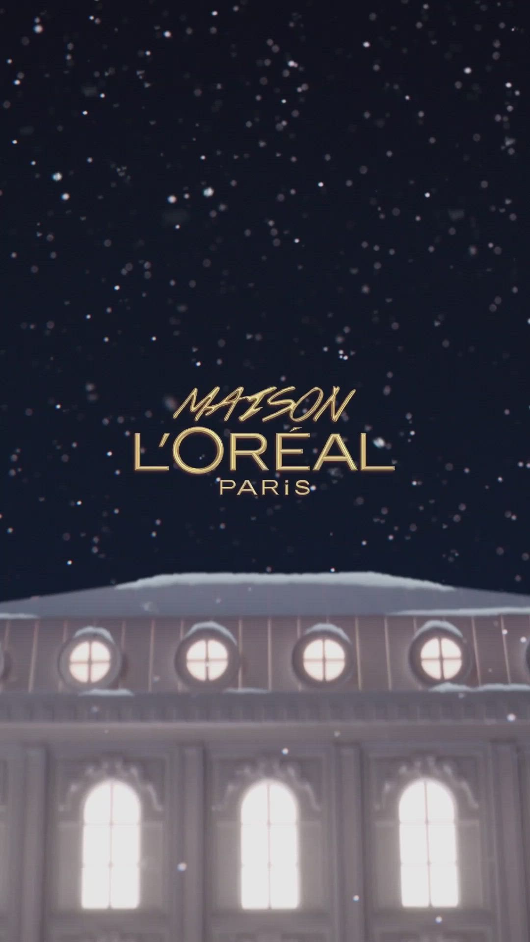 This may contain: the logo for maison l'oreal paris on top of a building at night