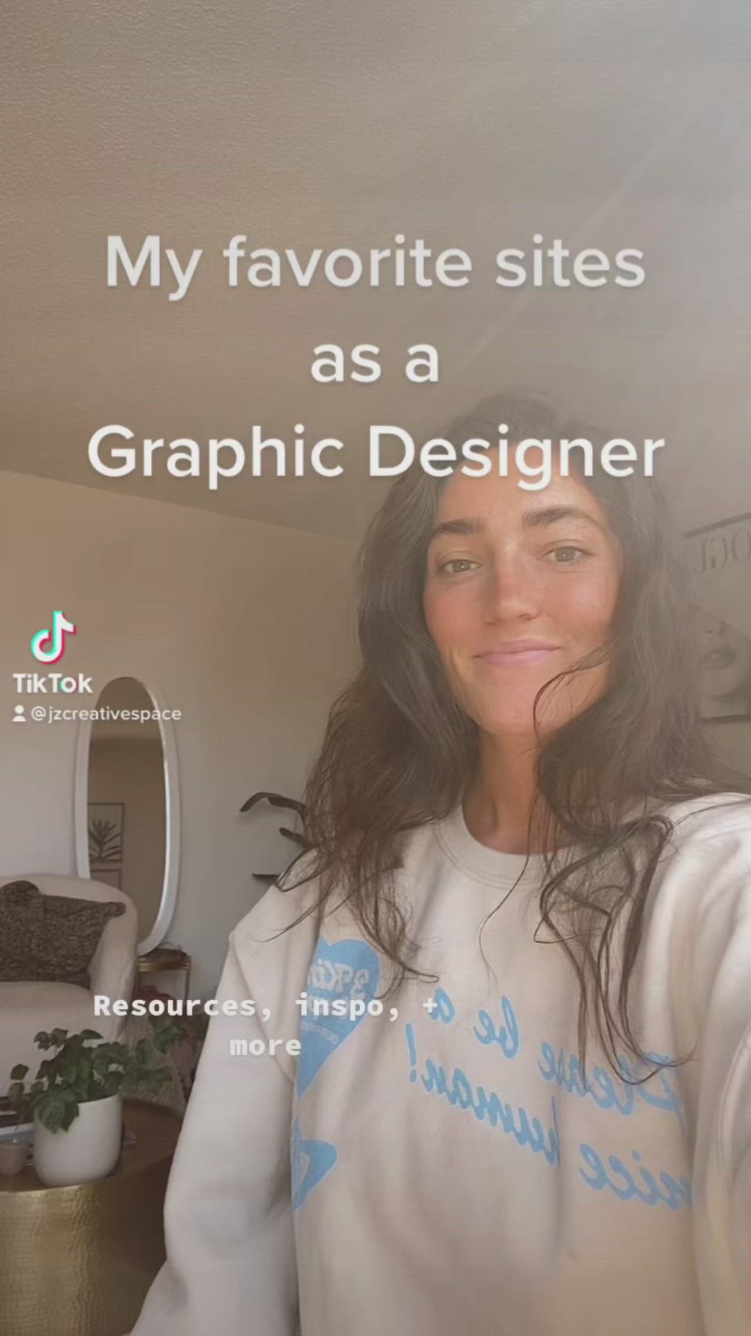 This may contain: a woman with long hair wearing a white sweatshirt and smiling at the camera, text reads my favorite sites as a graphic designer