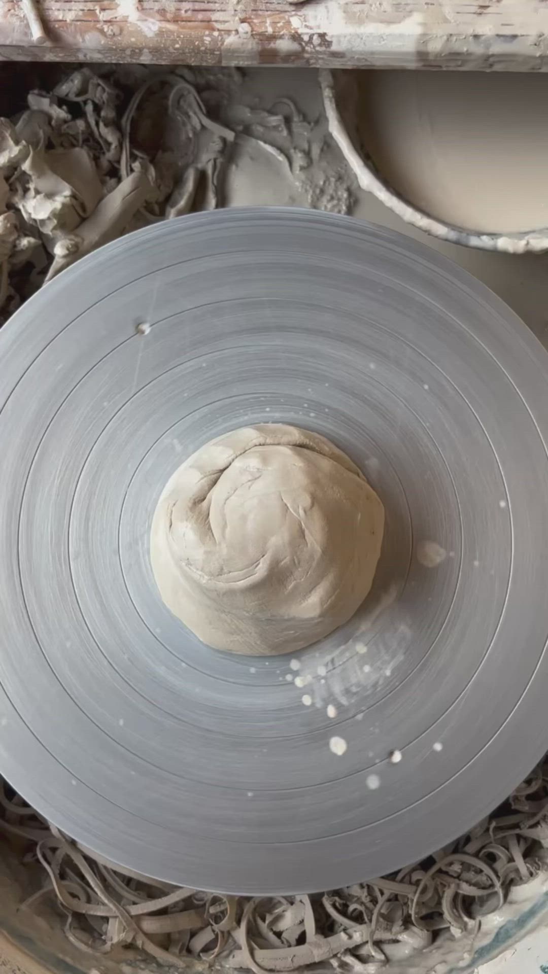 This may contain: a person is making a bowl out of clay