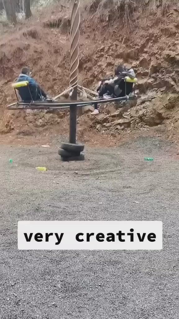 This may contain: an upside down chair sitting in the middle of a dirt field