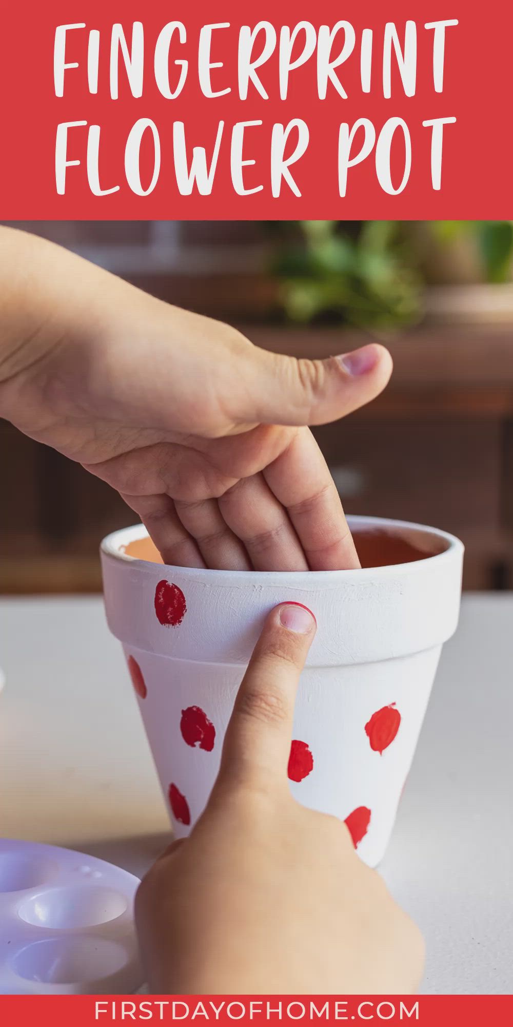 This contains: Painted flower pot with a ladybug pattern made using fingerprints from child