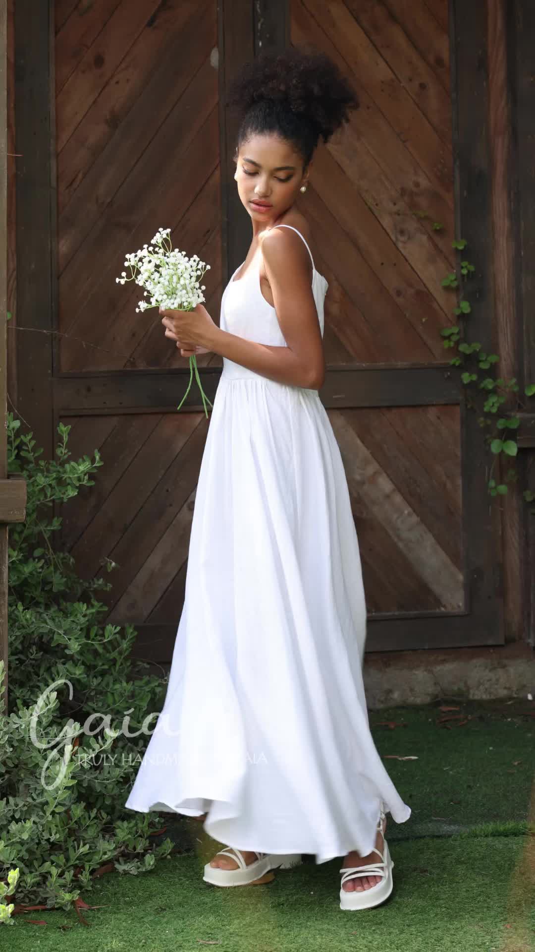 Feel the elegance of this linen wedding dress, crafted for timeless beauty. This classic design offers a sleeveless cut, a gathered waist, and seamless pockets. Made from washed linen, it provides a soft and breathable feel, perfect for your special day. You can explore our 100+ products at: https://madebygaia.vn/ #linenweddingdress