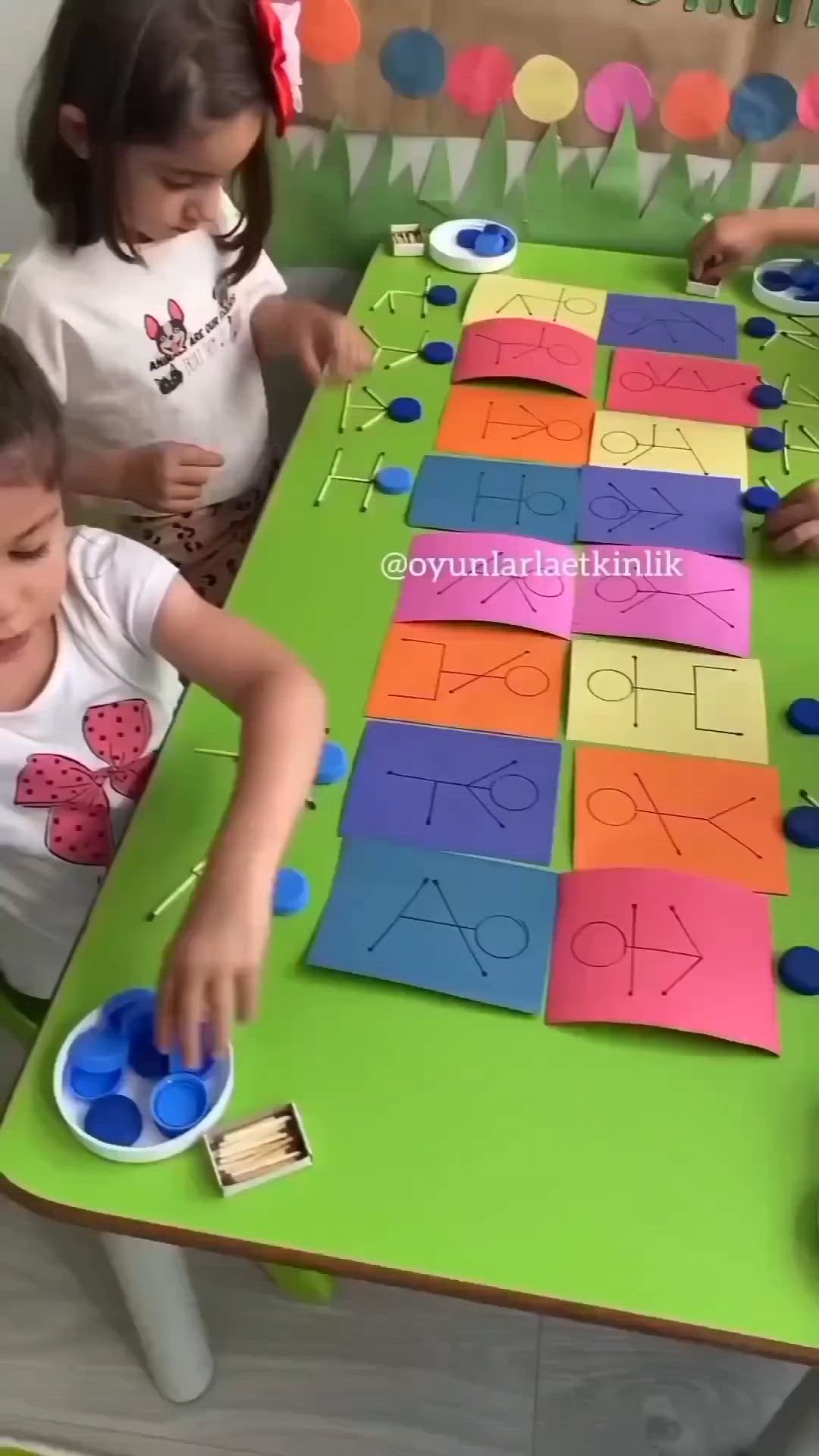 This may contain: two children are playing with letters and numbers