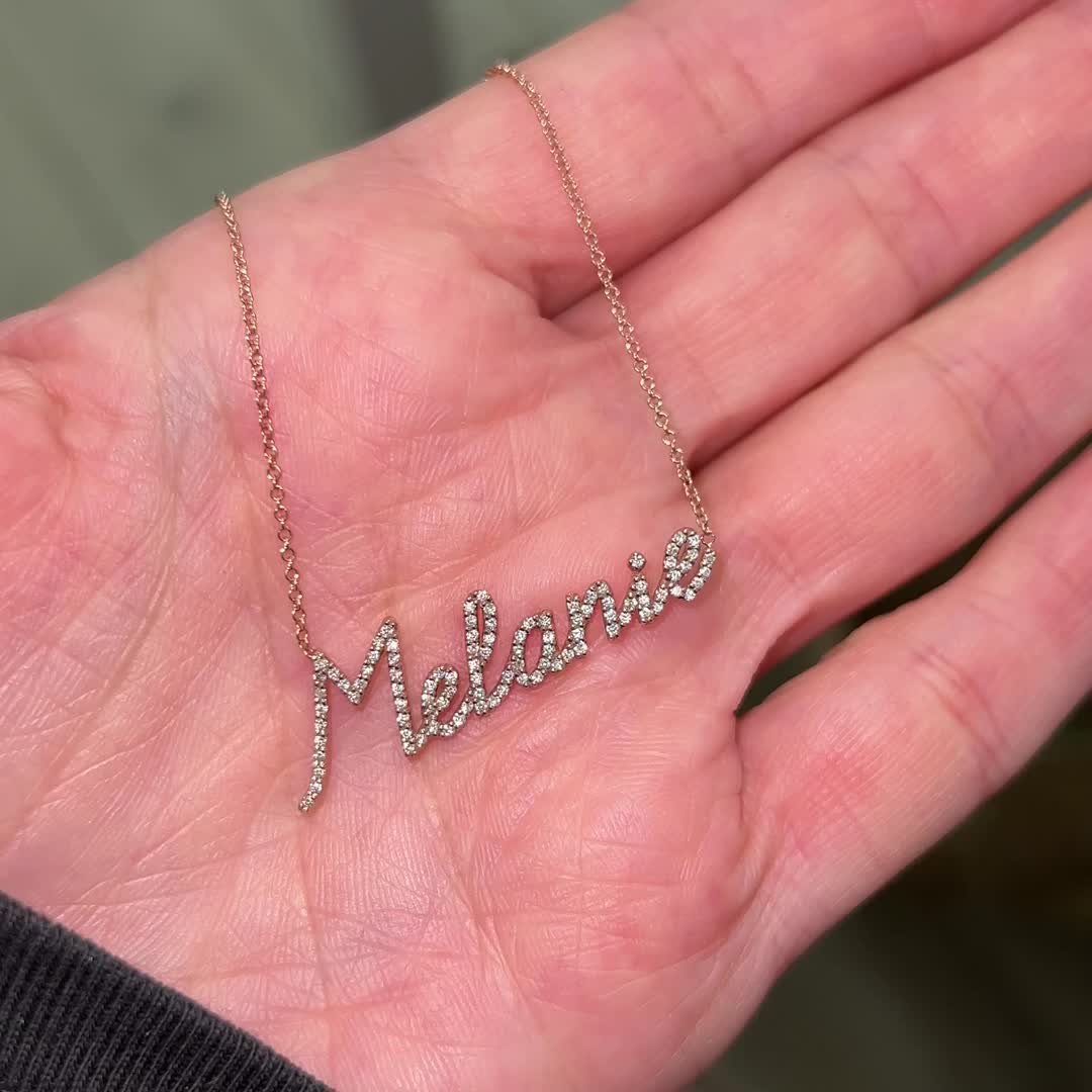 Our Diamond Custom Script Name Necklace is the newest addition to our name necklaces. Made for the true diamond lover!  Pick up to 10 letters or characters to create a one of a kind necklace. Set in solid 14K gold attached to a delicate cable chain with optional lengths. 

Largest letter ~13mm (1/2" Inch) - Shortest Letter ~6mm (1/4" Inch)
High Quality G Color VS2 Clarity Natural Diamonds

Average 7 Letter Name: 0.50ctw
14K Solid Gold
Lifetime Guarantee
Made in Los Angeles