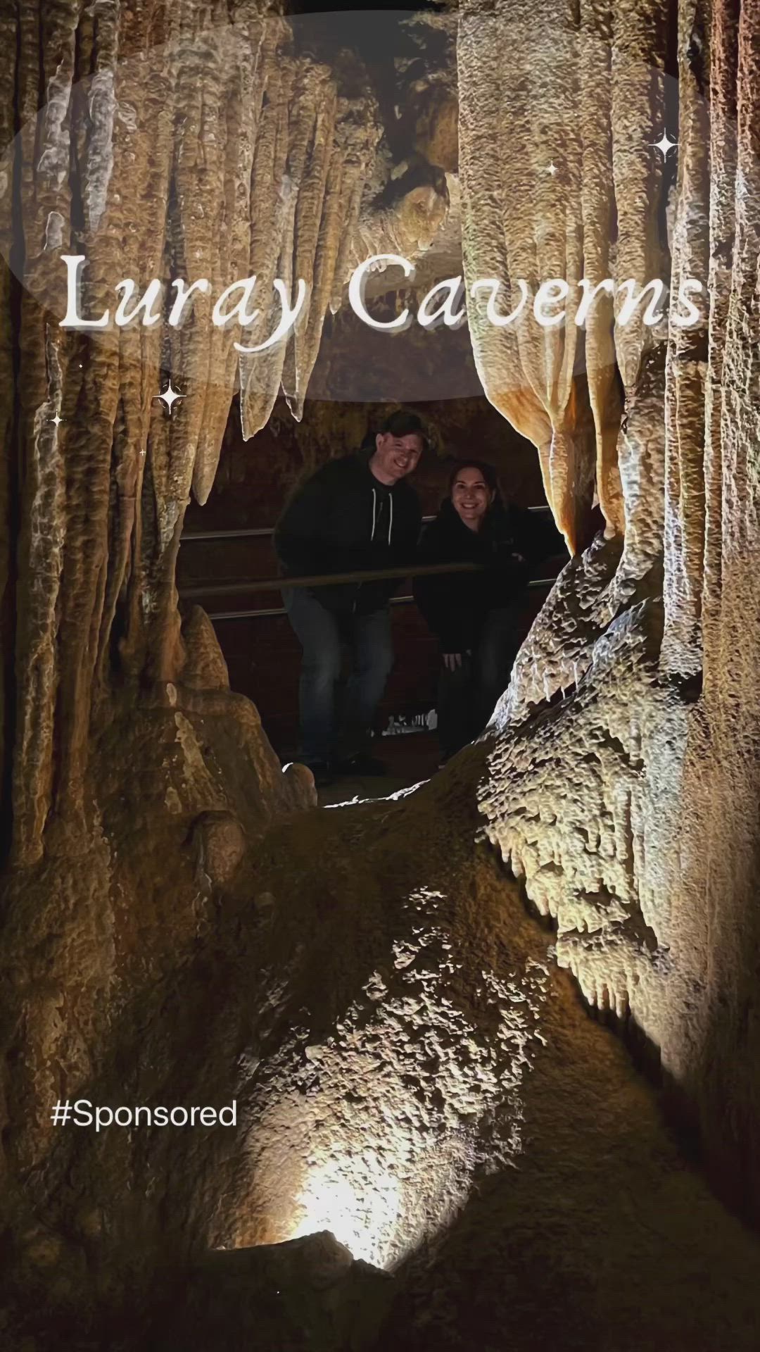 This may contain: two people sitting in the middle of a cave with text overlay that reads, living caverns